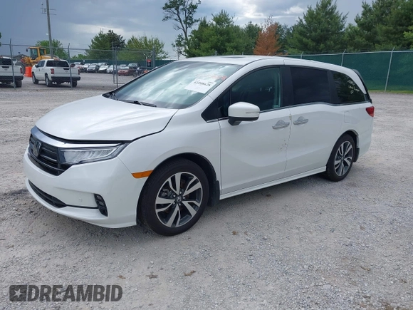 2023 Honda Odyssey Touring with VIN 5FNRL6H88PB079716, listed as a IAAI auction lot 42208628 with 26,679 mi miles and . Bid and sale history available at DreamBid. Image 2.
