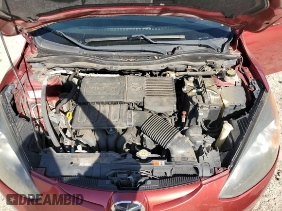 2014 Mazda 2 Touring z VIN JM1DE1LYXE0174854, wystawiony jako Copart lot #56712225 z przebiegiem 163 065 mil mil oraz Szkoda całkowita • Salvage title. Historia ofert i sprzedaży dostępna na DreamBid. Obrazek 11.