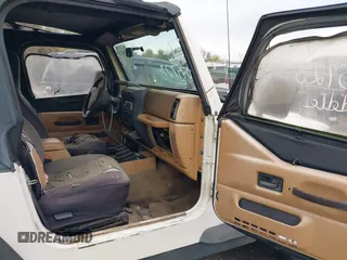 1998 Jeep Wrangler Sport with VIN 1J4FY19S0WP779147, listed as a IAAI auction lot 42045723 with 205,822 mi miles. Bid and sale history available at carsss.com. Image 5.