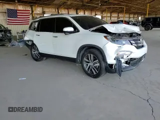 2018 Honda Pilot Touring с VIN 5FNYF6H98JB053524, выставлен на аукционе Copart как лот 61447785 с пробегом 114 942 миль миль и Списание • Salvage title. История ставок и продаж доступна на DreamBid. Изображение 13.