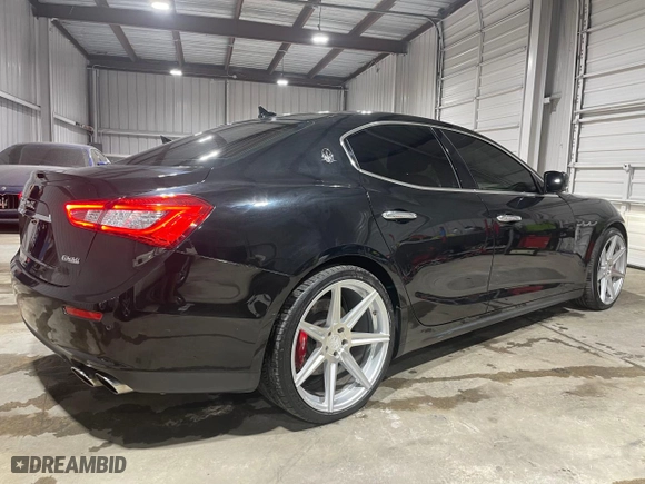 2014 Maserati Ghibli S Q4 with VIN ZAM57RTA9E1112724, listed as a Copart auction lot 73739204 with NaN miles and Salvage Title. Bid and sale history available at carsss.com. Image 4.