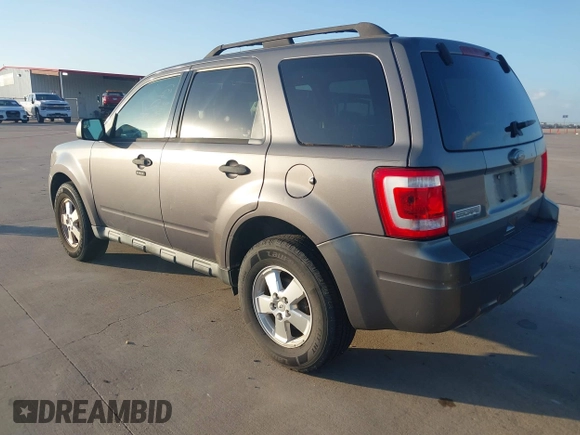 2011 Ford Escape XLT with VIN 1FMCU0D70BKA27369, listed as a IAAI auction lot 40970437 with 119,719 mi miles. Bid and sale history available at carsss.com. Image 3.
