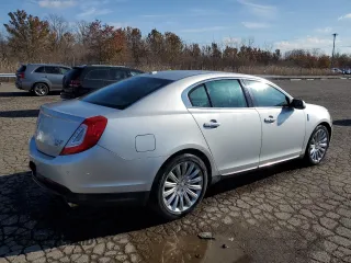 2014 Lincoln MKS with VIN 1LNHL9EK5EG606901, listed as a Copart auction lot 75300803 with 98,694 mi miles and Clean Title. Bid and sale history available at DreamBid. Image 3.