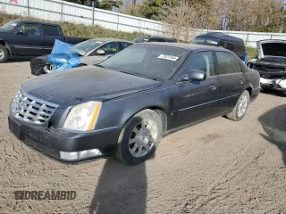 2009 Cadillac DTS 1SC z VIN 1G6KD57Y39U129722, wystawiony jako Copart lot #77071164 z przebiegiem 133 769 mil mil oraz Czysty tytuł • Clean title. Historia ofert i sprzedaży dostępna na DreamBid. Obrazek 1.