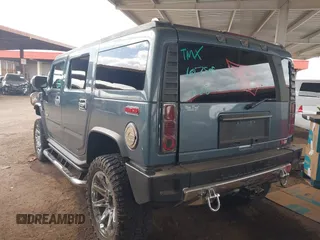 2005 Hummer H2 SUV with VIN 5GRGN23U25H107505, listed as a IAAI auction lot 41703768 with 213,723 mi miles. Bid and sale history available at carsss.com. Image 3.