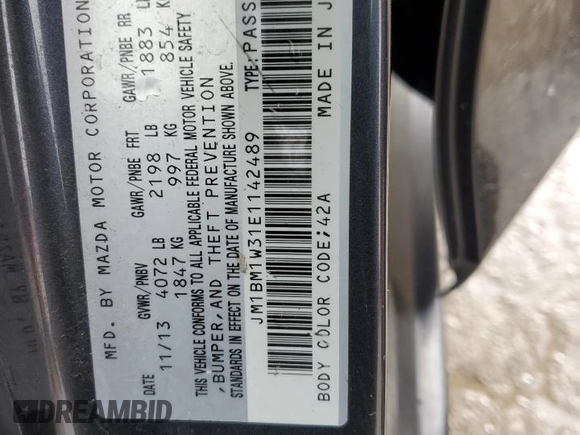 2014 Mazda 3 S Grand Touring z VIN JM1BM1W31E1142489, wystawiony jako Copart lot #43557485 z przebiegiem 158 399 mil mil oraz Szkoda całkowita • Salvage title. Historia ofert i sprzedaży dostępna na DreamBid. Obrazek 12.