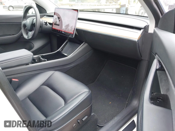 2021 Tesla Model Y Long Range with VIN 5YJYGDEE6MF082883, listed as a IAAI auction lot 42078807 with 64,953 mi miles. Bid and sale history available at carsss.com. Image 5.
