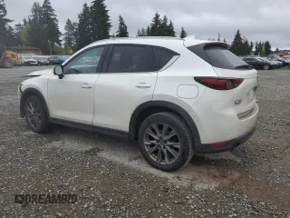 2021 Mazda CX-5 Signature with VIN JM3KFBEY3M0410998, listed as a Copart auction lot 54868885 with 73,207 mi miles and Salvage Title. Bid and sale history available at carsss.com. Image 2.