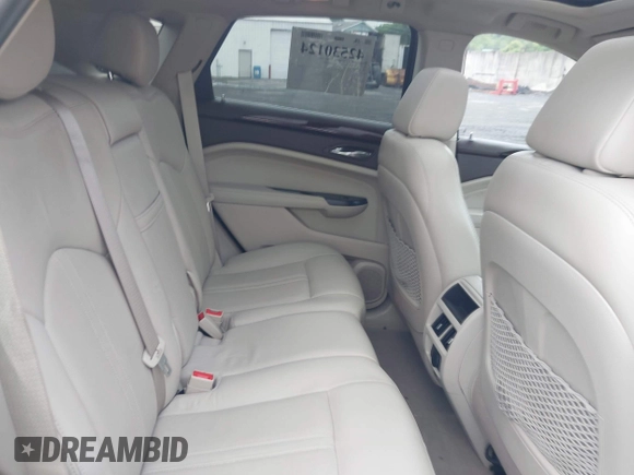 2013 Cadillac SRX Performance Collection with VIN 3GYFNHE34DS628486, listed as a IAAI auction lot 42530124 with 76,778 mi miles and . Bid and sale history available at DreamBid. Image 8.