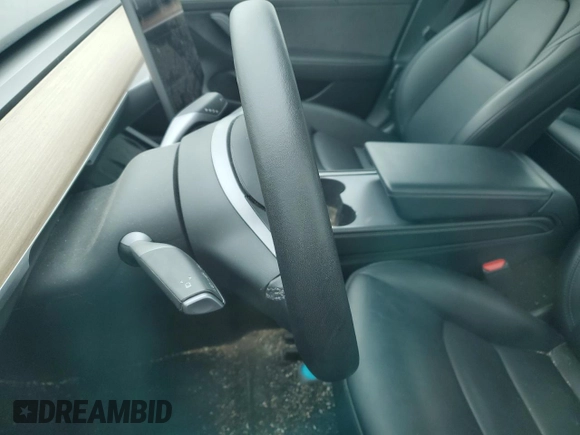 2023 Tesla Model 3 with VIN 5YJ3E1EA7PF599058, listed as a Copart auction lot 57331365 with Not provided miles and Non repairable. Bid and sale history available at DreamBid. Image 9.