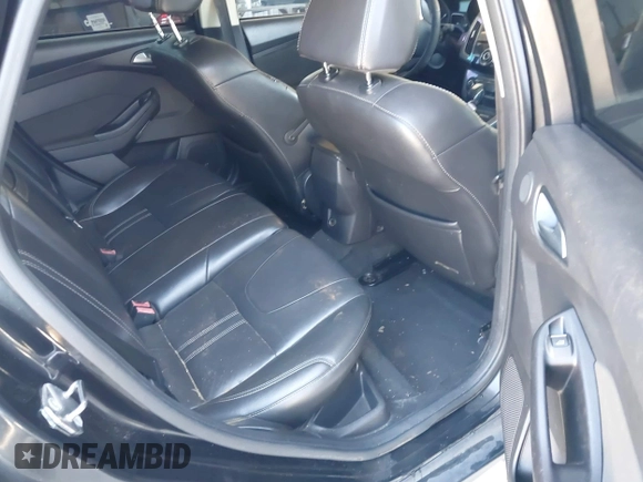2013 Ford Focus Titanium with VIN 1FADP3J20DL143491, listed as a IAAI auction lot 42034388 with 194,388 mi miles and . Bid and sale history available at carsss.com. Image 8.