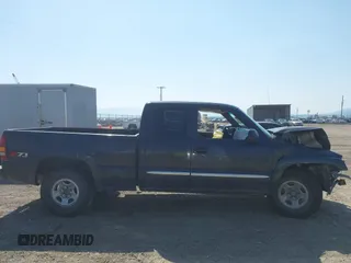 2003 GMC Sierra 1500 SLT z VIN 1GTEK19T03E191705, wystawiony jako IAAI lot #42145392 z przebiegiem Nie podano mil oraz . Historia ofert i sprzedaży dostępna na DreamBid. Obrazek 14.
