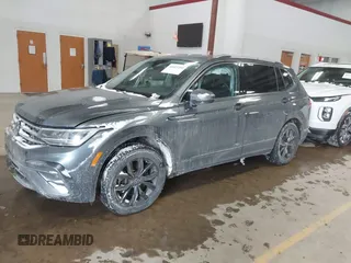 2023 Volkswagen Tiguan SE with VIN 3VVMB7AX5PM013447, listed as a IAAI auction lot 41615200 with 66,259 mi miles and . Bid and sale history available at DreamBid. Image 2.