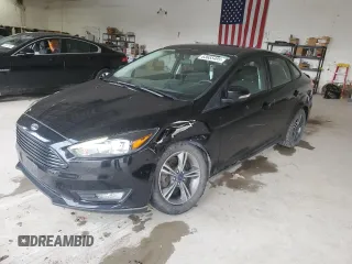 2018 Ford Focus SE with VIN 1FADP3FE5JL228471, listed as a Copart auction lot 63655495 with 92,405 mi miles and Salvage title. Bid and sale history available at DreamBid. Image 1.
