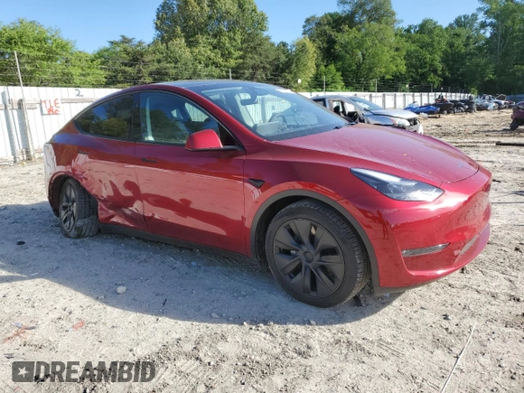 2024 Tesla Model Y Long Range with VIN 7SAYGDEE6RA318973, listed as a Copart auction lot 55586435 with 8,700 mi miles and Salvage title. Bid and sale history available at DreamBid. Image 4.