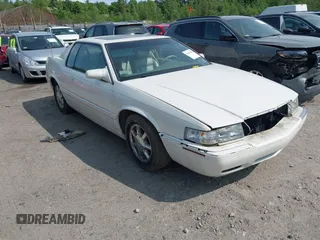 2000 Cadillac Eldorado Touring ETC z VIN 1G6ET129XYU162451, wystawiony jako IAAI lot #42412406 z przebiegiem 89 413 mil mil oraz . Historia ofert i sprzedaży dostępna na DreamBid. Obrazek 1.