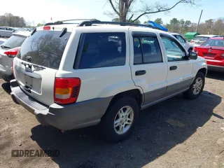 2004 Jeep Grand Cherokee Laredo with VIN 1J4GW48S54C314056, listed as a IAAI auction lot 42096065 with 164,113 mi miles. Bid and sale history available at carsss.com. Image 4.
