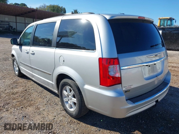 2012 Chrysler Town & Country Touring with VIN 2C4RC1BGXCR338160, listed as a IAAI auction lot 41042918 with 214,961 mi miles and . Bid and sale history available at DreamBid. Image 3.