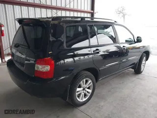 2007 Toyota Highlander Hybrid w/3rd Row with VIN JTEEW21A570035193, listed as a IAAI auction lot 41571679 with 143,627 mi miles. Bid and sale history available at carsss.com. Image 4.