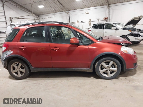 2009 Suzuki SX4 AWD z VIN JS2YB413295100359, wystawiony jako IAAI lot #40899442 z przebiegiem 109 919 mil mil oraz . Historia ofert i sprzedaży dostępna na DreamBid. Obrazek 13.