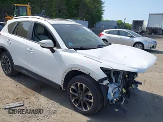 2016 Mazda CX-5 Grand Touring z VIN JM3KE4DY2G0798486, wystawiony jako IAAI lot #42224073 z przebiegiem 131 733 mil mil oraz . Historia ofert i sprzedaży dostępna na DreamBid. Obrazek 1.
