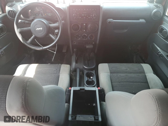 2007 Jeep Wrangler Unlimited X with VIN 1J4GA39187L161451, listed as a Copart auction lot 55280905 with 214,660 mi miles and Salvage Title. Bid and sale history available at DreamBid. Image 8.