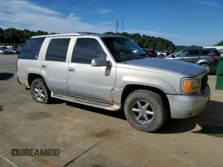 1999 GMC Denali z VIN 1GKEK13R0XR916686, wystawiony jako Copart lot #61120914 z przebiegiem 240 605 mil mil oraz Szkody całkowita. Historia ofert i sprzedaży dostępna na DreamBid. Obrazek 4.