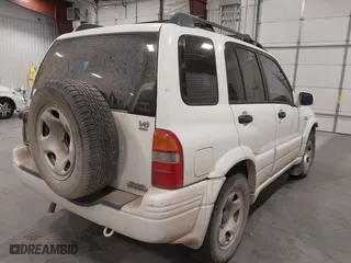 2000 Suzuki Grand Vitara JLX with VIN JS3TD62VXY4130242, listed as a IAAI auction lot 41701849 with 106,700 mi miles. Bid and sale history available at carsss.com. Image 4.