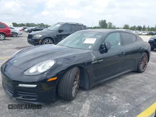 2015 Porsche Panamera S E-Hybrid z VIN WP0AD2A72FL040703, wystawiony jako IAAI lot #41937431 z przebiegiem 77 933 mil mil oraz . Historia ofert i sprzedaży dostępna na DreamBid. Obrazek 2.