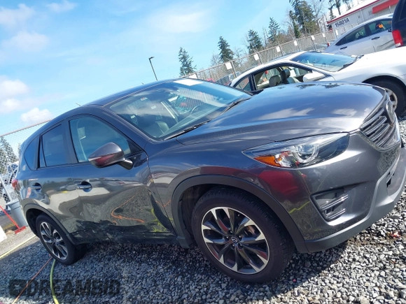 2016 Mazda CX-5 Grand Touring with VIN JM3KE4DY9G0895006, listed as a IAAI auction lot 41703146 with 39,359 mi miles. Bid and sale history available at carsss.com. Image 13.