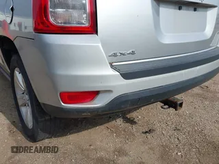 2013 Jeep Compass Sport with VIN 1C4NJDBB4DD119077, listed as a IAAI auction lot 42142532 with 131,679 mi miles. Bid and sale history available at carsss.com. Image 6.