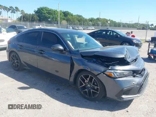 2023 Honda Civic Sport Touring z VIN 19XFL1H80PE017819, wystawiony jako IAAI lot #41833813 z przebiegiem 26 279 mil mil oraz . Historia ofert i sprzedaży dostępna na DreamBid. Obrazek 1.