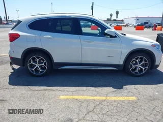 2017 BMW X1 xDrive28i with VIN WBXHT3C33H5F86831, listed as a IAAI auction lot 42019082 with 74,708 mi miles and . Bid and sale history available at DreamBid. Image 13.