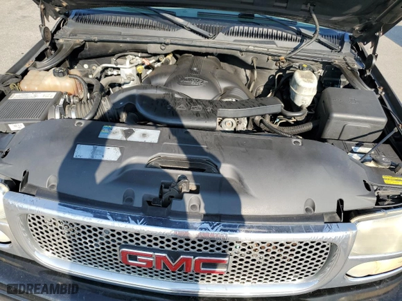 2004 GMC Yukon Denali with VIN 1GKEK63U74J212674, listed as a Copart auction lot 69704734 with 174,893 mi miles and Salvage Title. Bid and sale history available at carsss.com. Image 12.