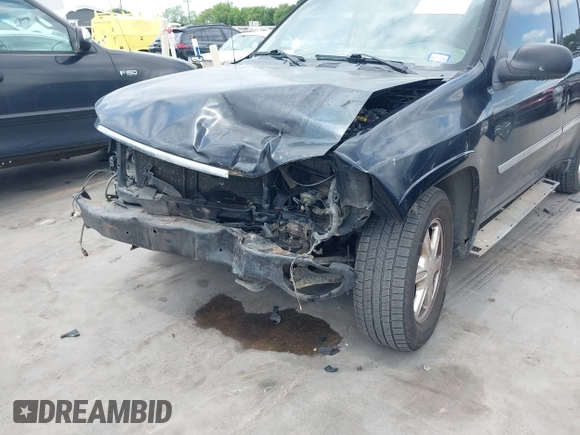 2009 GMC Envoy SLE z VIN 1GKDS33S592105035, wystawiony jako IAAI lot #42089058 z przebiegiem 249 127 mil mil oraz . Historia ofert i sprzedaży dostępna na DreamBid. Obrazek 6.
