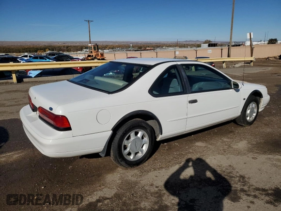1994 Ford Thunderbird LX with VIN 1FALP62WXRH217279, listed as a Copart auction lot 80512504 with 176,798 mi miles and Salvage Title. Bid and sale history available at DreamBid. Image 3.