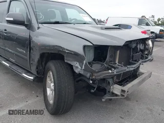 2014 Toyota Tacoma PreRunner with VIN 3TMKU4HN9EM041509, listed as a IAAI auction lot 42441194 with 290,715 mi miles and . Bid and sale history available at DreamBid. Image 6.