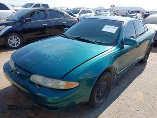 1999 Oldsmobile Alero GL z VIN 1G3NL52T0XC354966, wystawiony jako IAAI lot #42259258 z przebiegiem Nie podano mil oraz . Historia ofert i sprzedaży dostępna na DreamBid. Obrazek 6.