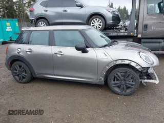 2017 MINI Hardtop 4 Door Cooper S z VIN WMWXU3C58H2D33073, wystawiony jako IAAI lot #41913081 z przebiegiem 51 631 mil mil oraz . Historia ofert i sprzedaży dostępna na DreamBid. Obrazek 14.