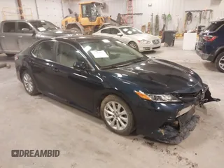 2020 Toyota Camry LE with VIN 4T1C11AK5LU926564, listed as a IAAI auction lot 41864812 with 104,212 mi miles and . Bid and sale history available at carsss.com. Image 1.