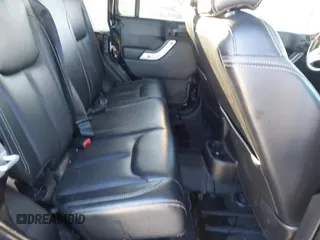 2015 Jeep Wrangler Unlimited Rubicon with VIN 1C4BJWFGXFL610153, listed as a IAAI auction lot 41575401 with 114,583 mi miles. Bid and sale history available at carsss.com. Image 8.