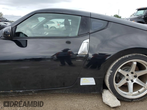 2009 Nissan 370Z Touring with VIN JN1AZ44E29M406023, listed as a Copart auction lot 73721324 with 108,072 mi miles and Salvage Title. Bid and sale history available at carsss.com. Image 12.