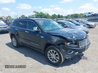 2014 Jeep Grand Cherokee Limited z VIN 1C4RJFBTXEC140898, wystawiony jako IAAI lot #42793097 z przebiegiem 159 542 mil mil oraz . Historia ofert i sprzedaży dostępna na DreamBid. Obrazek 1.