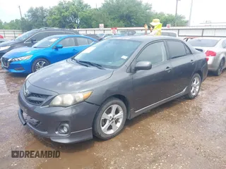 2011 Toyota Corolla L with VIN 2T1BU4EE6BC679516, listed as a IAAI auction lot 42104879 with 184,014 mi miles. Bid and sale history available at carsss.com. Image 2.