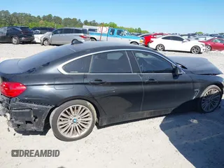 2015 BMW 4 Series 428i with VIN WBA4A5C51FG051393, listed as a IAAI auction lot 42041960 with 136,929 mi miles and . Bid and sale history available at carsss.com. Image 13.