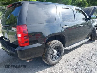 2013 Chevrolet Tahoe Commercial with VIN 1GNLC2E00DR265941, listed as a IAAI auction lot 42289977 with 206,840 mi miles and . Bid and sale history available at DreamBid. Image 4.