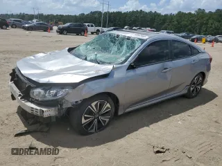 2018 Honda Civic EX-L z VIN JHMFC1F77JX003657, wystawiony jako Copart lot #59992665 z przebiegiem 59 008 mil mil oraz Szkoda całkowita • Salvage title. Historia ofert i sprzedaży dostępna na DreamBid. Obrazek 1.