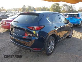 2021 Mazda CX-5 Grand Touring Reserve with VIN JM3KFBAYXM0465762, listed as a IAAI auction lot 40728368 with 30,667 mi miles. Bid and sale history available at carsss.com. Image 4.