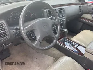 2000 Infiniti Q45 z VIN JNKBY31A0YM700503, wystawiony jako Copart lot #59358045 z przebiegiem 121 244 mil mil oraz Tytuł czysty. Historia ofert i sprzedaży dostępna na DreamBid. Obrazek 9.