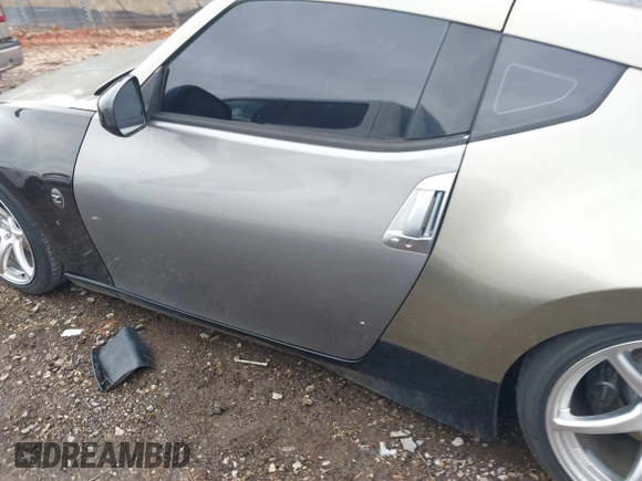 2009 Nissan 370Z Touring with VIN JN1AZ44E69M404341, listed as a IAAI auction lot 41907551 with 144,612 mi miles and . Bid and sale history available at DreamBid. Image 14.